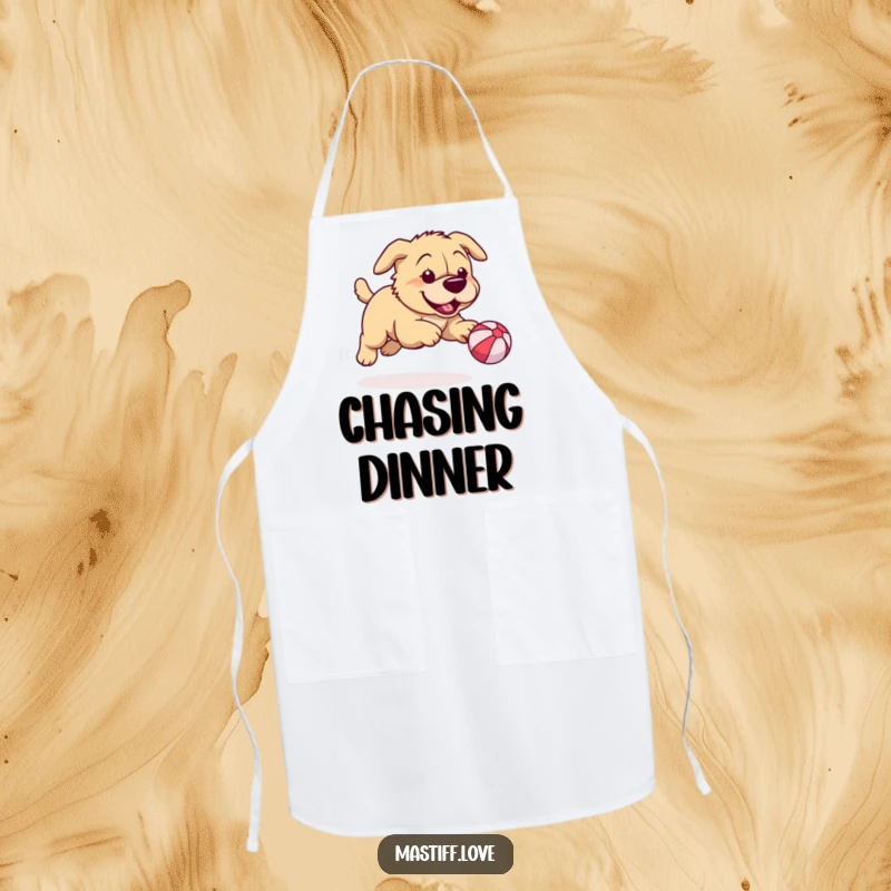 Funny mastiff apron featuring a playful dog chasing a ridiculously small bouncy ball, perfect for adding humor to cooking.