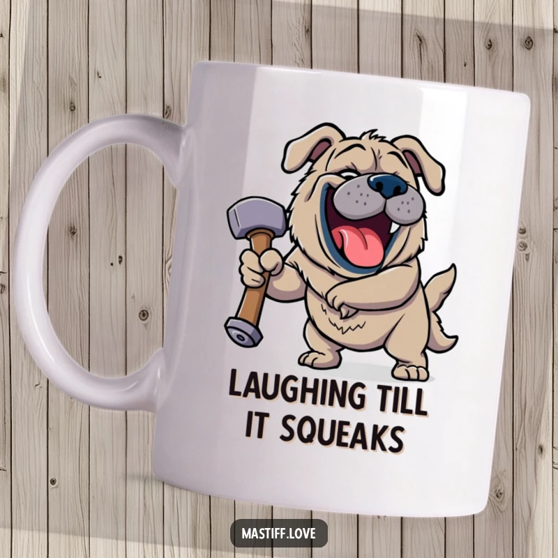 Funny Jovial Mastiff Mug showing a happy dog roaring with laughter while holding a comically large squeaky hammer with a gleeful expression.