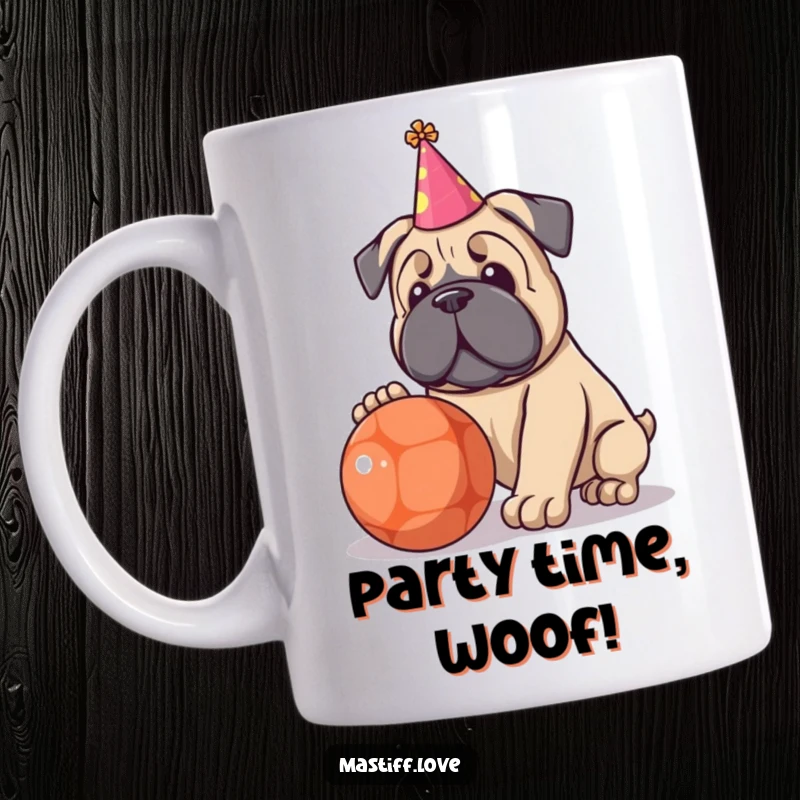 Funny mug with a kawaii Mastiff puppy wearing a tiny party hat, joyfully playing with a large ball.